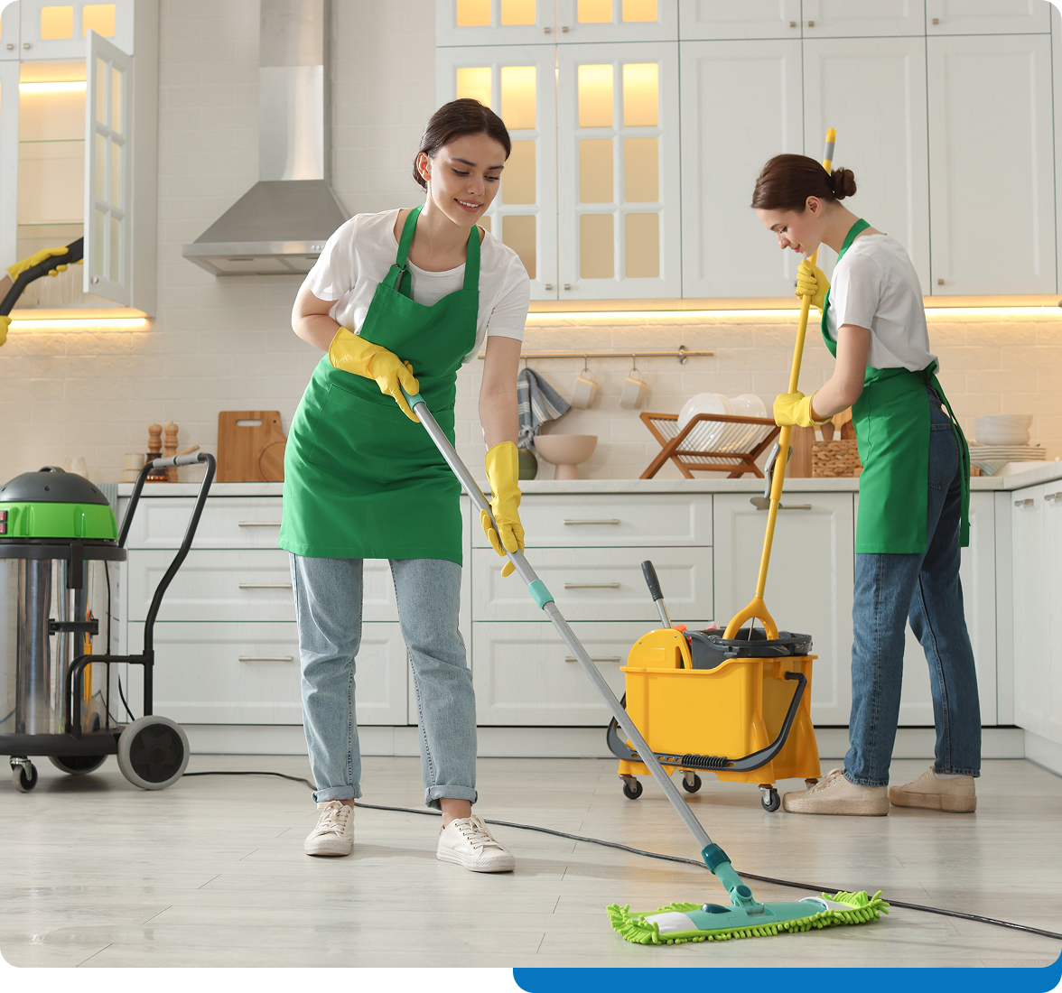 Two people cleaning a modern kitchen.