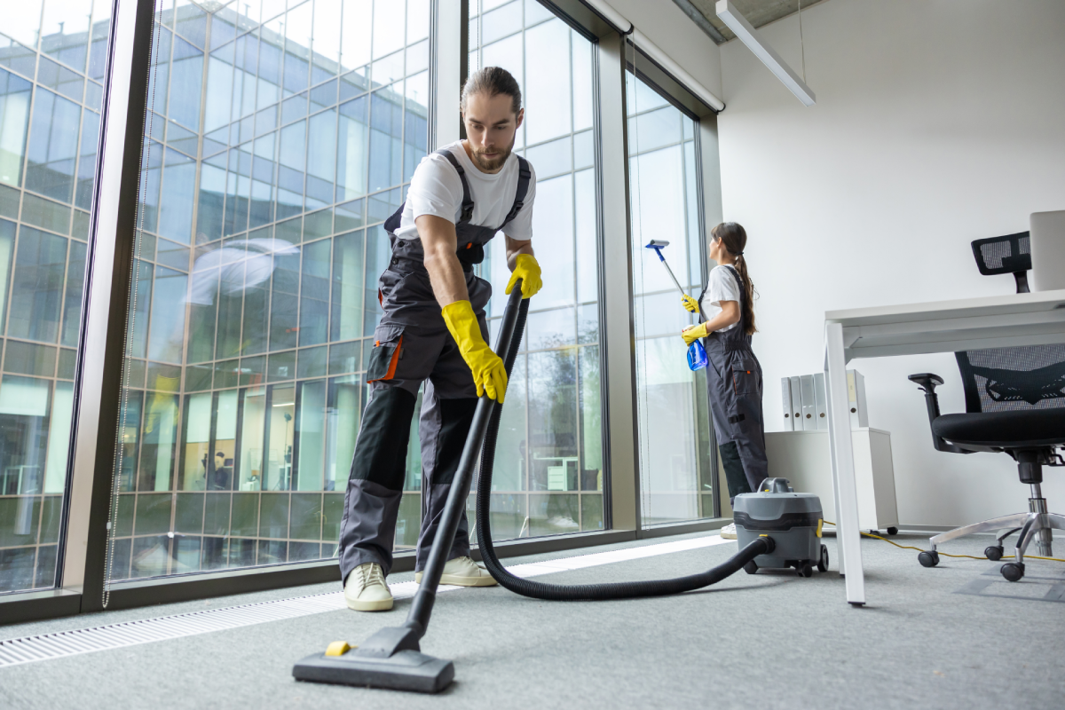 Office cleaning with vacuum and window cleaning.